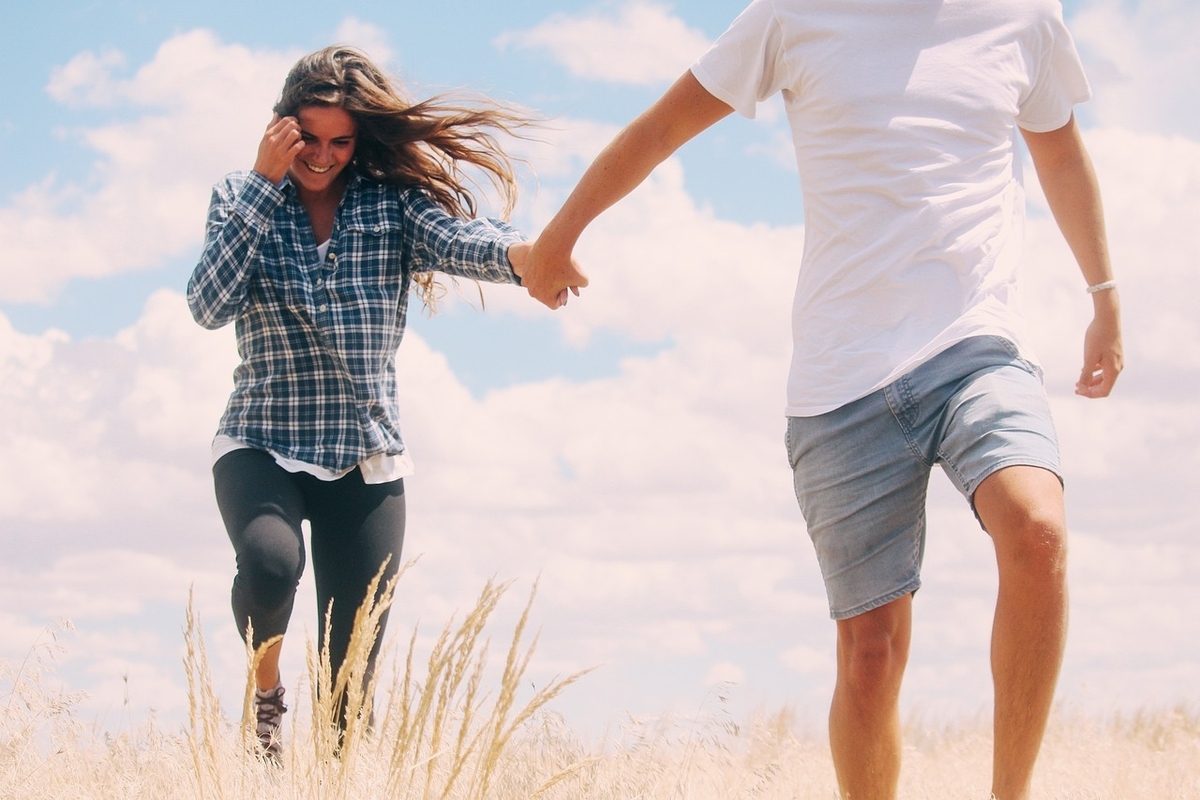 Man and woman walking in the field